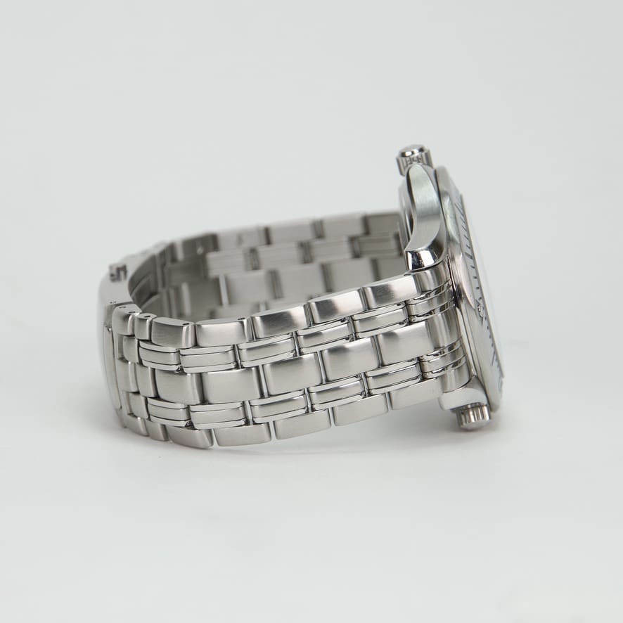 Silver wristwatch with metal bracelet side view.
