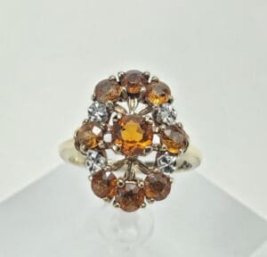 Gold ring with amber gemstones and diamonds.