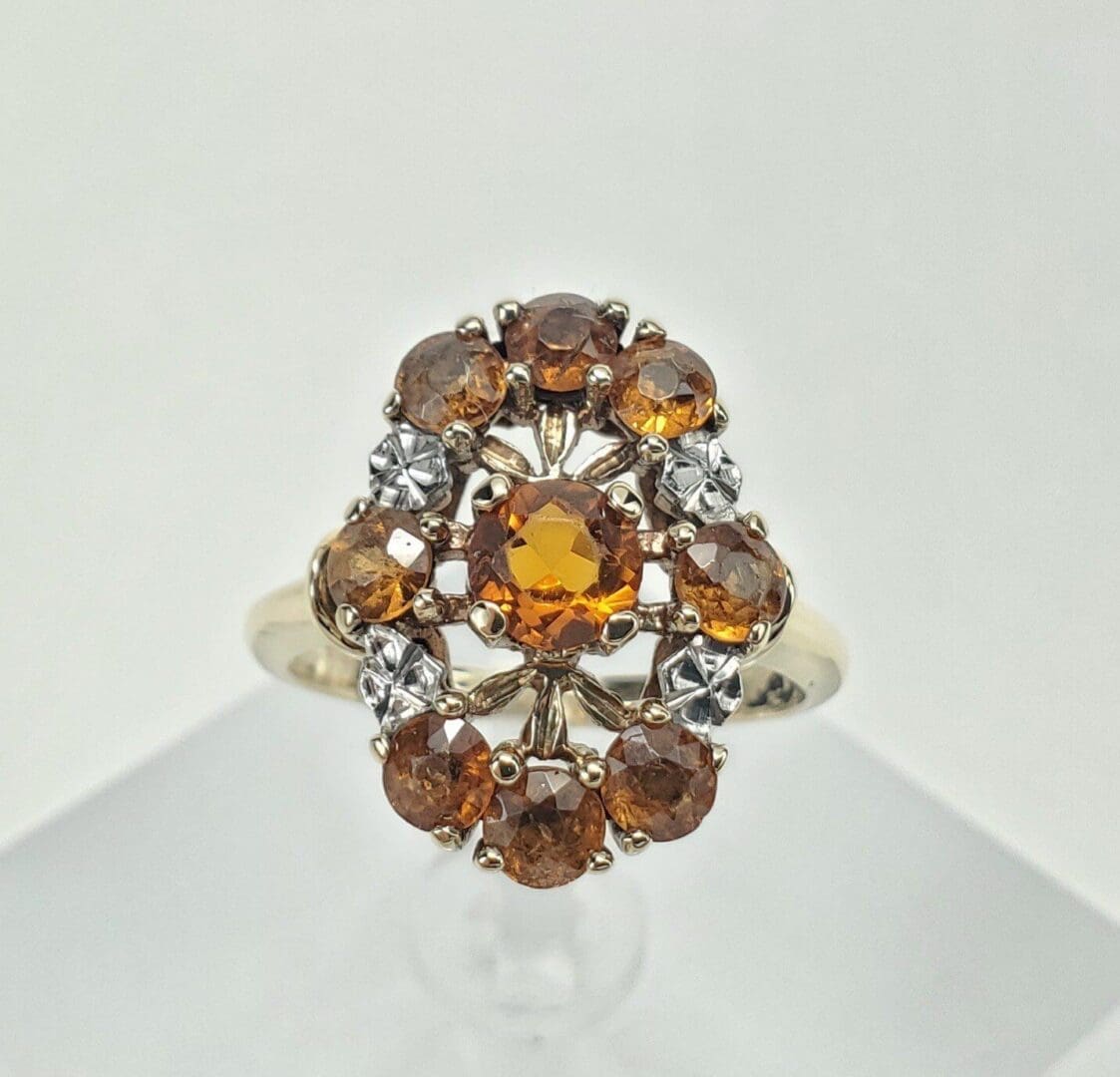 Gold ring with amber gemstones and diamonds.