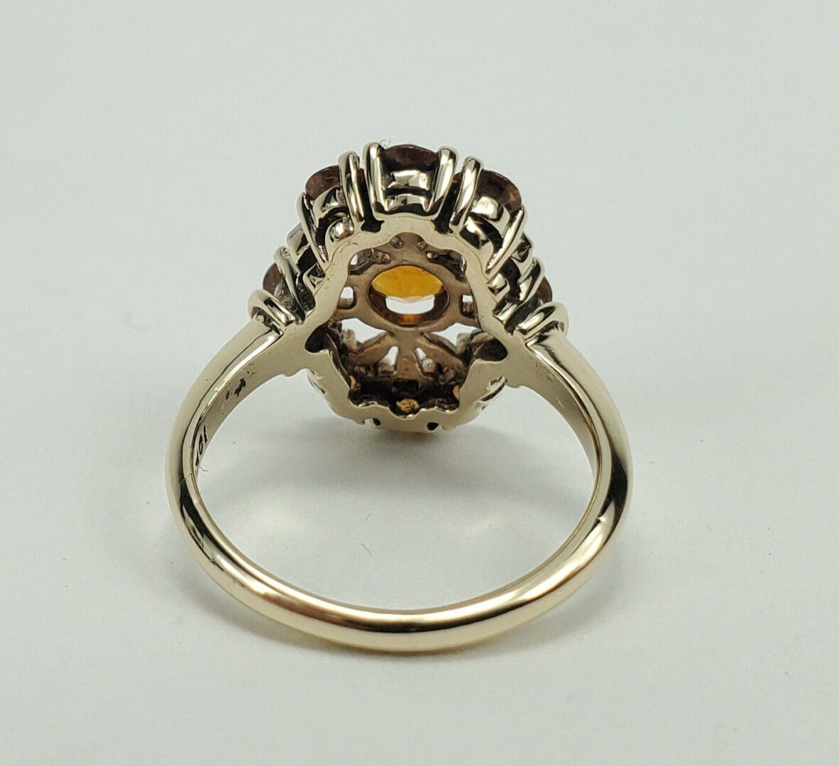 Gold ring with intricate gemstone setting.
