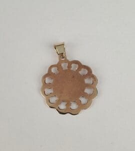 Gold scalloped pendant on white background.