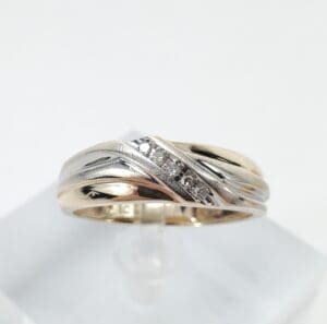 Gold and silver ring with diamonds.
