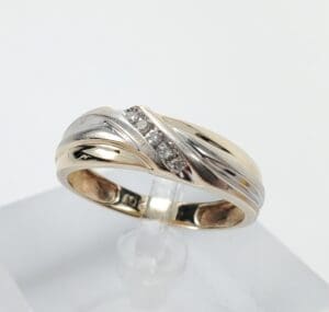Gold and silver ring with small diamonds.