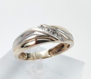 Gold and silver ring with diamonds.