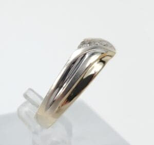 Gold and silver ring with diamonds.