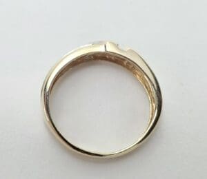 Gold ring with a simple, elegant design.