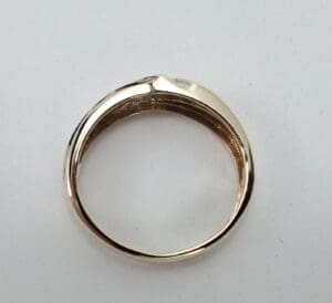 Gold ring on a white background.