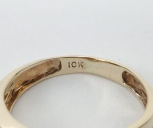 Gold ring with "10K" engraving inside.