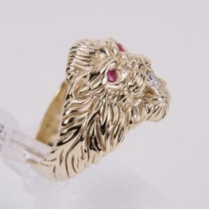 Gold lion ring with ruby eyes.