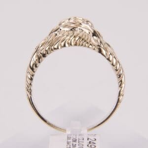 Gold ring with intricate swirling design.