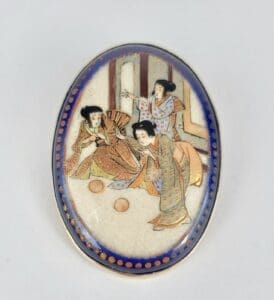 Japanese artwork depicting three people in kimonos.