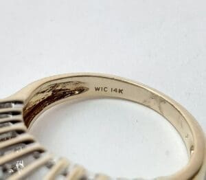 Gold ring engraved with "WIC 14K".