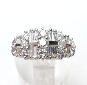 Silver ring with clear gemstones, elegant design.