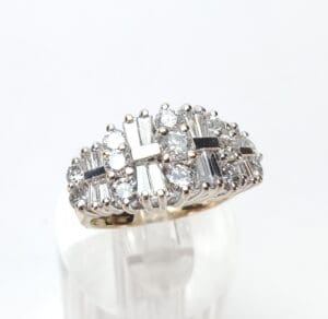 Gold ring with diamonds in intricate design.