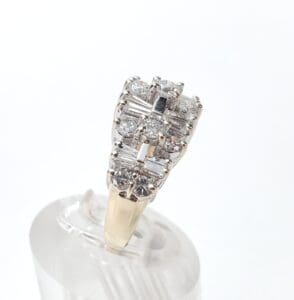 Gold ring with multiple diamond settings.