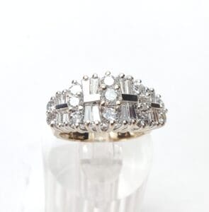 Diamond ring with intricate geometric design.