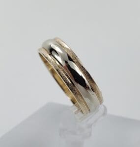 Gold and silver dual band ring.