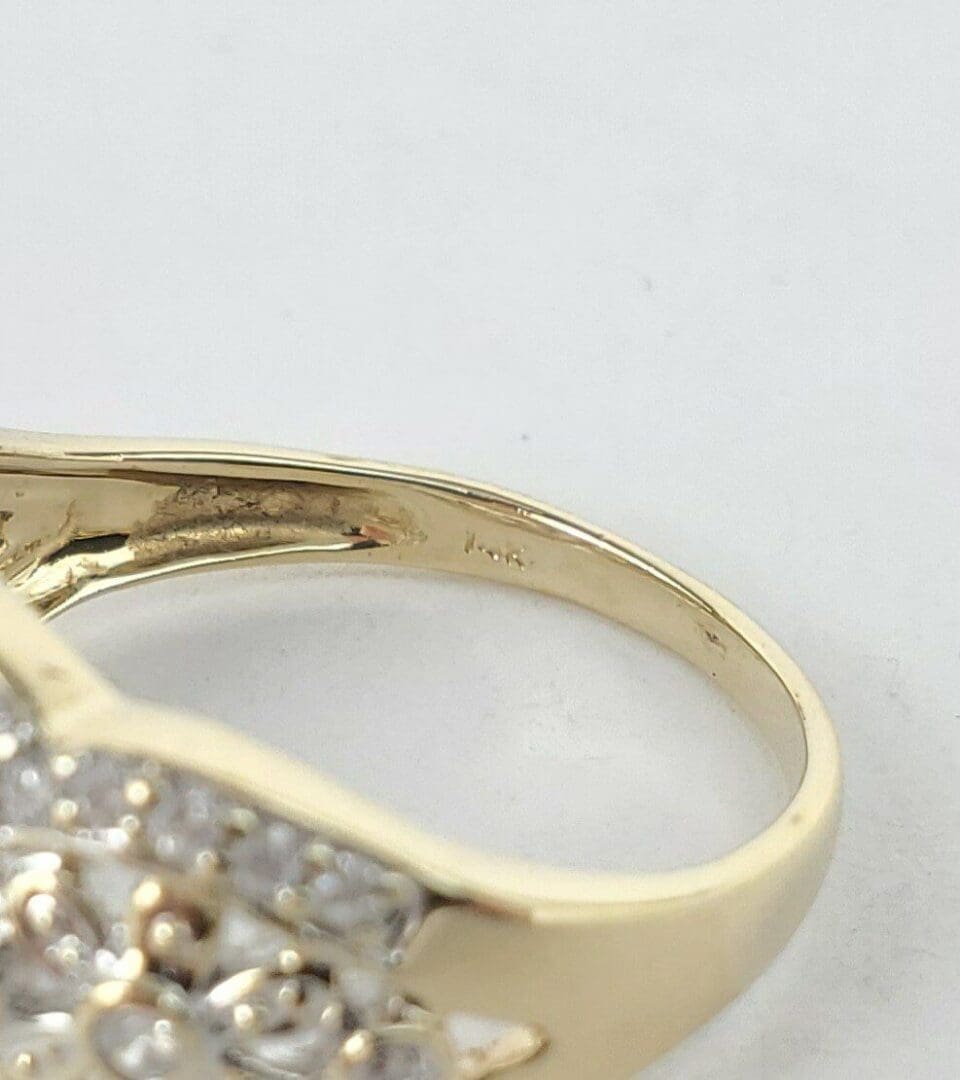 Gold ring with diamond accents, close-up.
