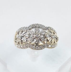 Diamond-studded ornate gold ring.