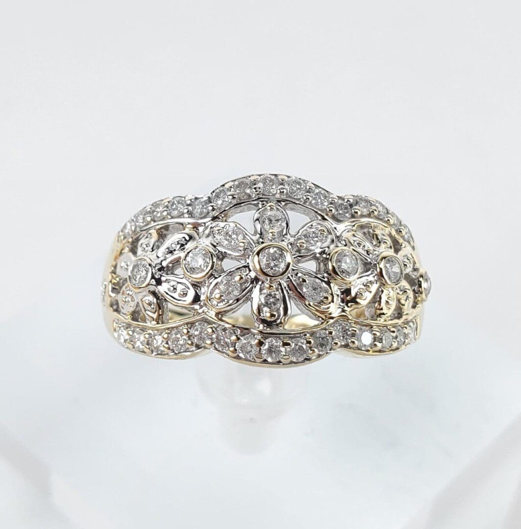 Diamond-studded ornate gold ring.