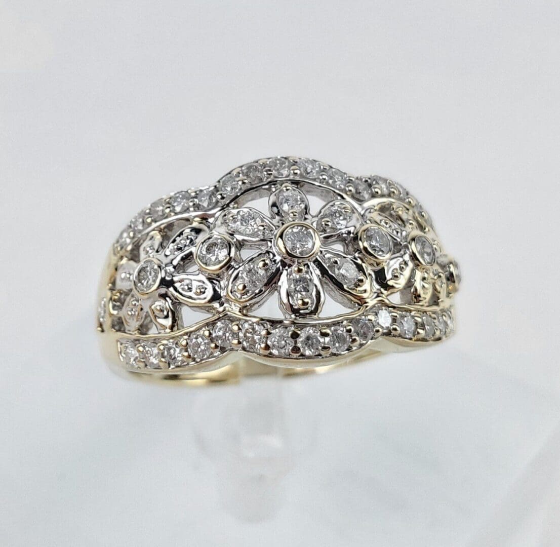 Diamond floral-patterned ring with intricate design.