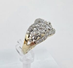 Gold ring with intricate diamond design.