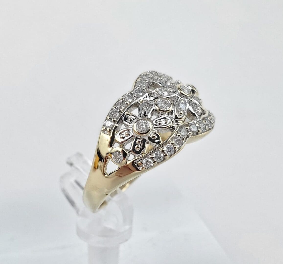 Gold ring with intricate diamond design.