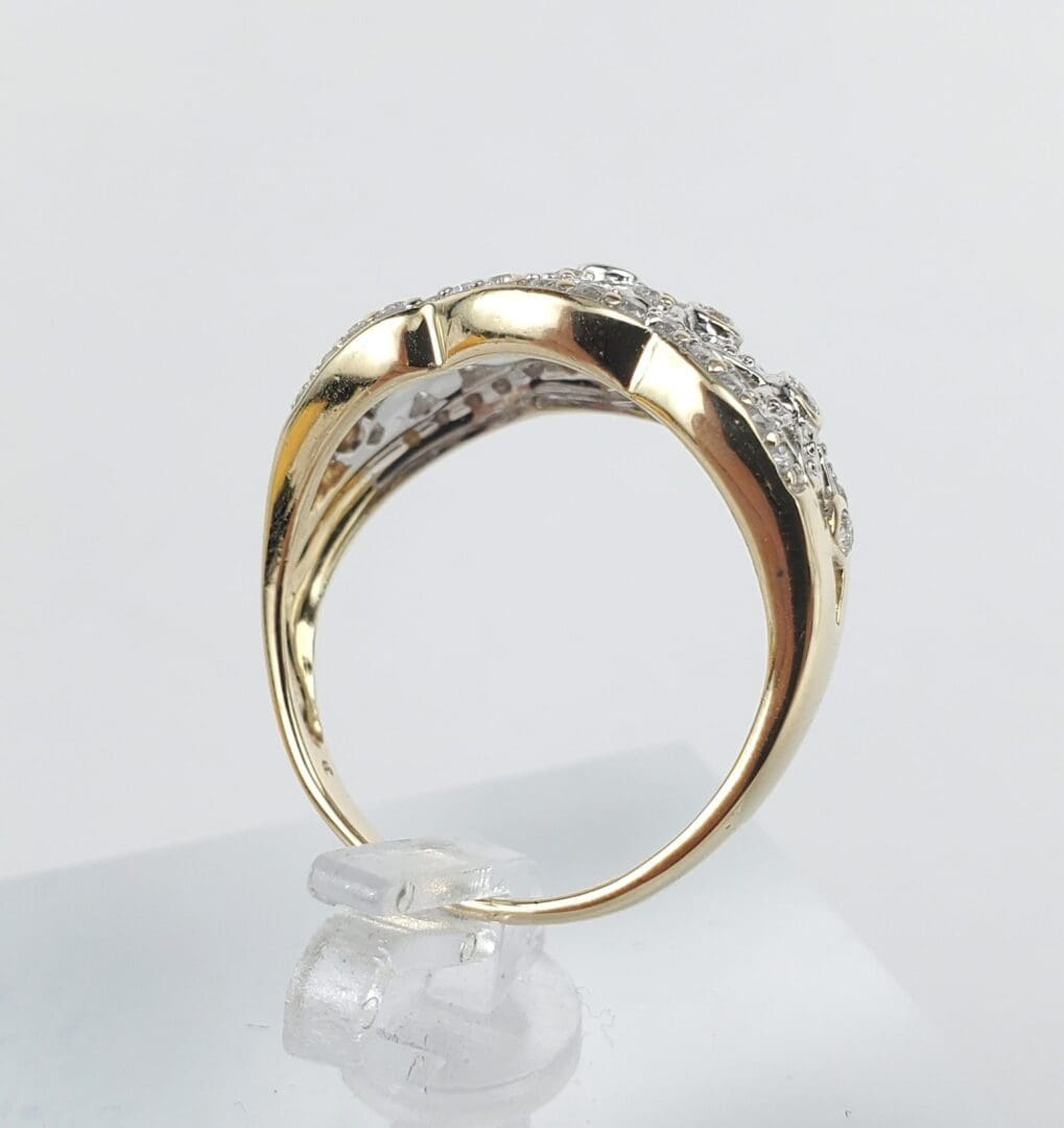Gold ring with diamond accents on display.