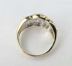 Gold ring with a decorative band design.