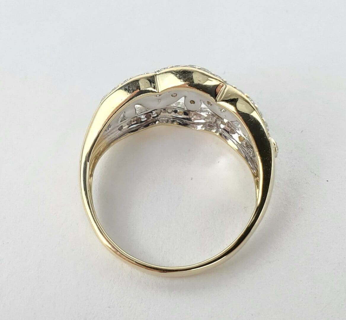 Gold ring with a decorative band design.