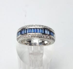 Silver ring with blue and clear stones.