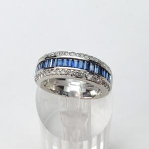 Silver ring with blue and clear stones.