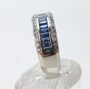 Silver ring with blue and clear stones.