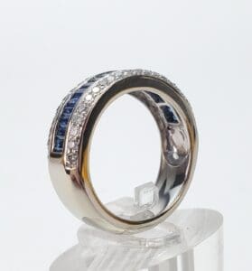 Silver ring with blue and clear stones.