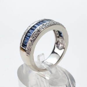 Silver ring with blue and clear stones.