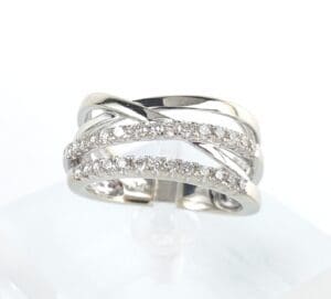 Silver ring with intertwined diamond bands.