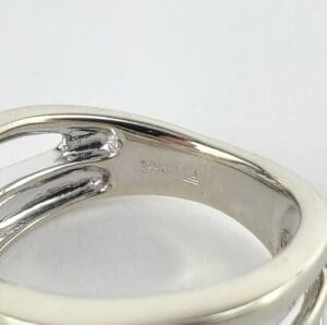 Silver ring with 14K hallmark engraving.