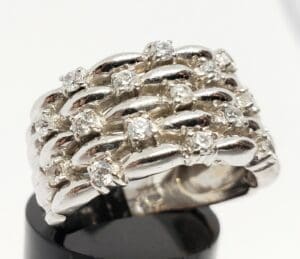 Silver ring with multiple rows of diamonds.