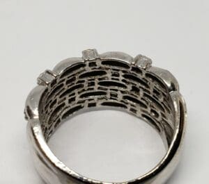 Silver ring with intricate inner design.