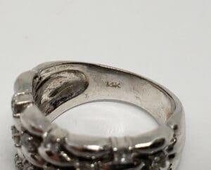 Silver ring with "14K" engraving inside band.