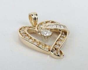 Gold heart pendant with diamonds.