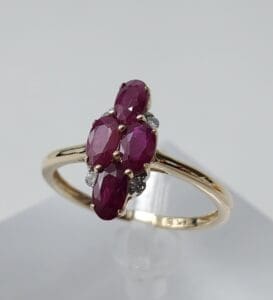 Gold ring with multiple ruby stones.