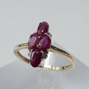 Gold ring with multiple ruby stones.