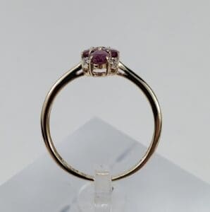 Gold ring with a red gemstone.