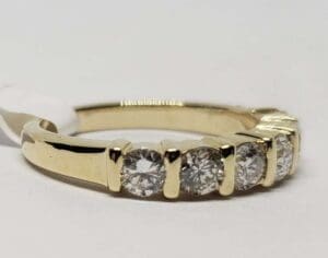 Gold ring with five sparkling diamonds.