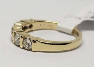 Gold ring with multiple small diamonds.