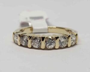 Gold ring with seven sparkling diamonds.