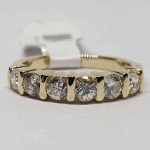 Gold ring with seven sparkling diamonds.