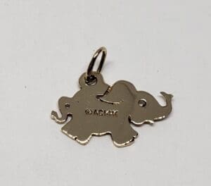 Elephant-shaped gold pendant with loop.