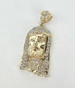 Gold Jesus face pendant with diamonds.